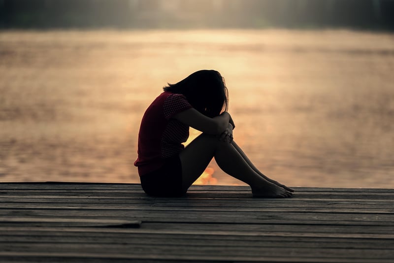 Lonely woman sitting in contemplation